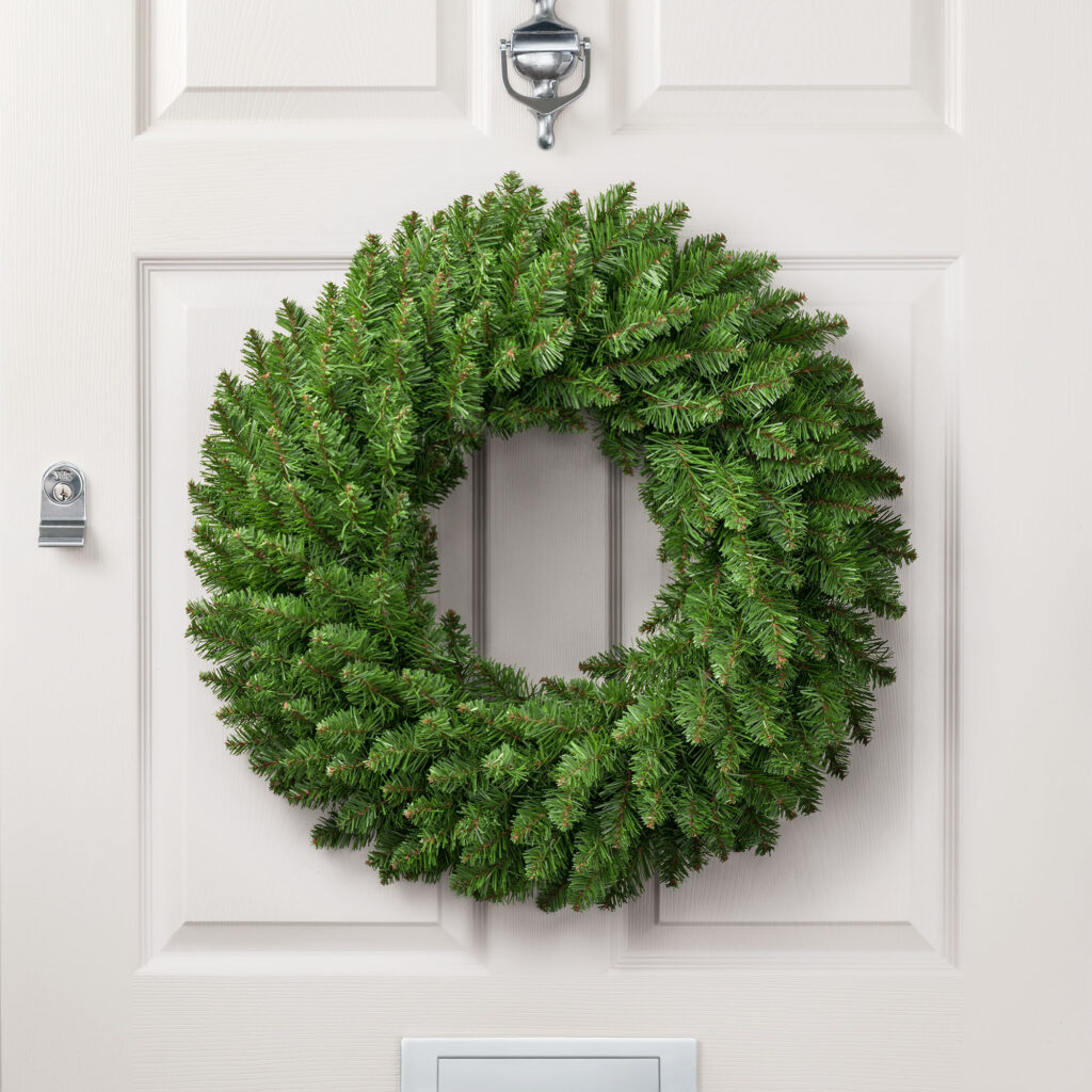 Christow Spruce Wreath hanging on a door.