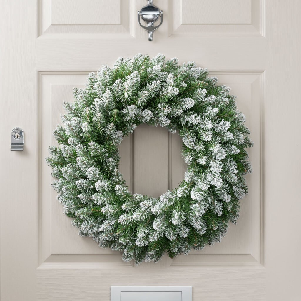 Christow Frosted Wreath hanging on a door.