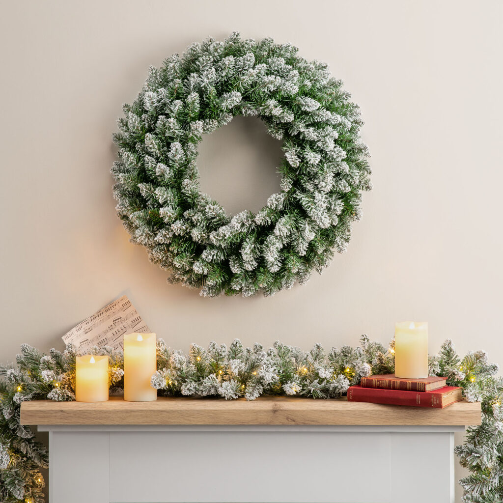 Christow Frosted Garland with a Frosted Wreath hanging above it.