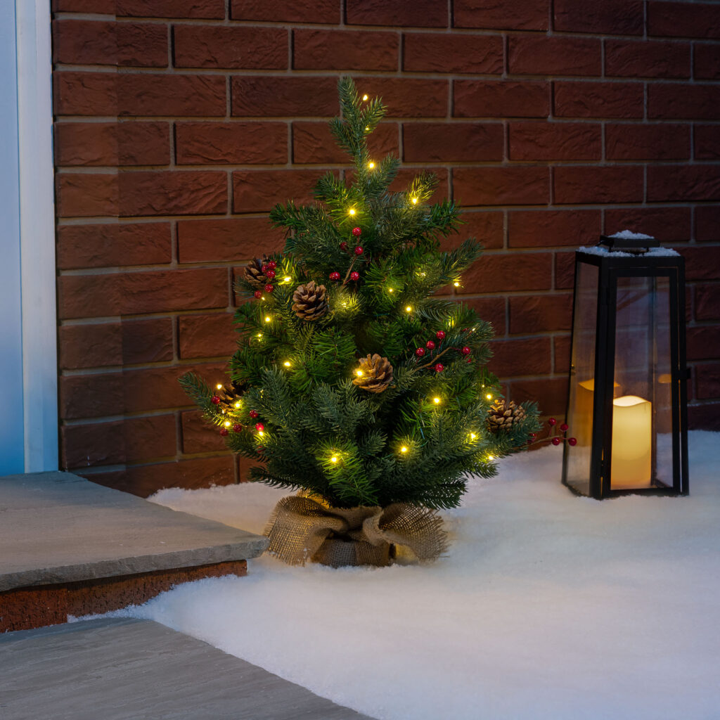 Christow 2ft Mini Christmas Tree decorated with Warm White LED String Lights.